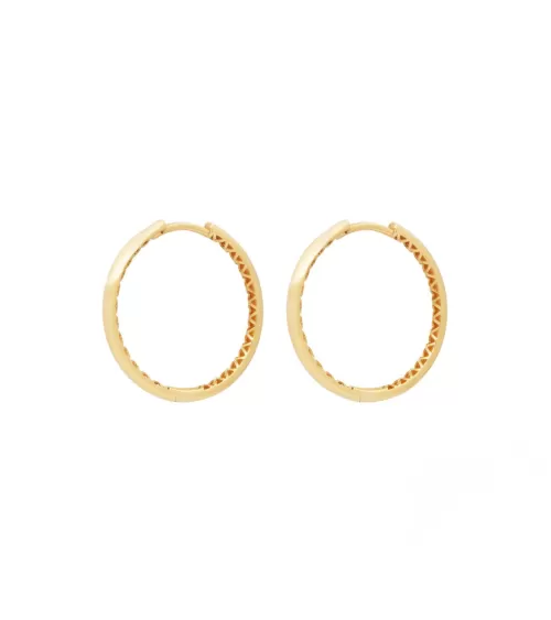 Aros ovalados de oro de 18 quilates con un diamante | Staring